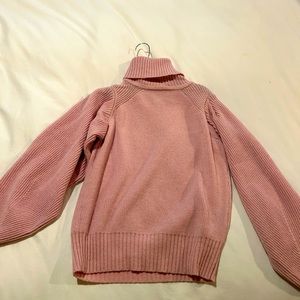 Pink turtleneck sweater from Intermix